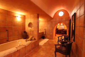 Mount Etjo Safari Lodge – warm-lit bathroom with bathtub