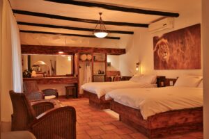 Namibia safari lodge – double bedroom with timber furniture