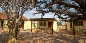 Namtib Biosphere Reserve – lodge bungalows beneath mature desert trees