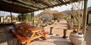 Namtib Desert Lodge – shaded outdoor dining terrace