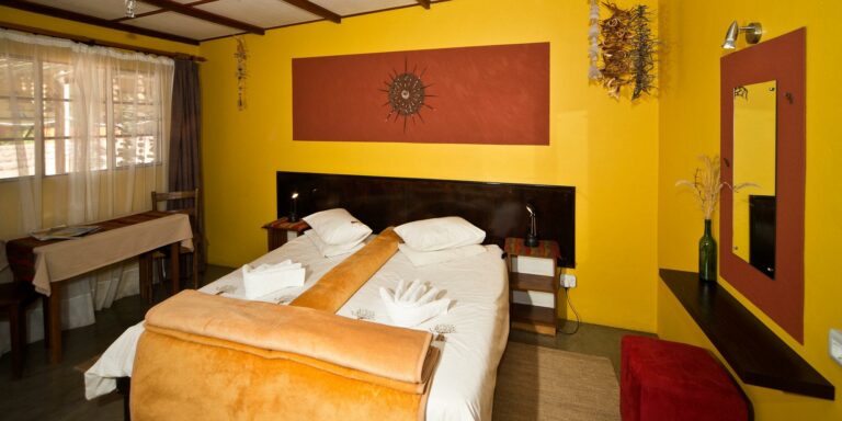 Tiras Mountains accommodation – colourful double bedroom interior