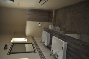 Shametu River Lodge – private campsite kitchenette and bathroom area