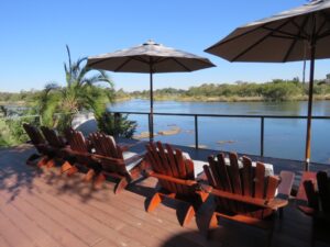 Popa Falls accommodation – river deck arranged for sunset viewing
