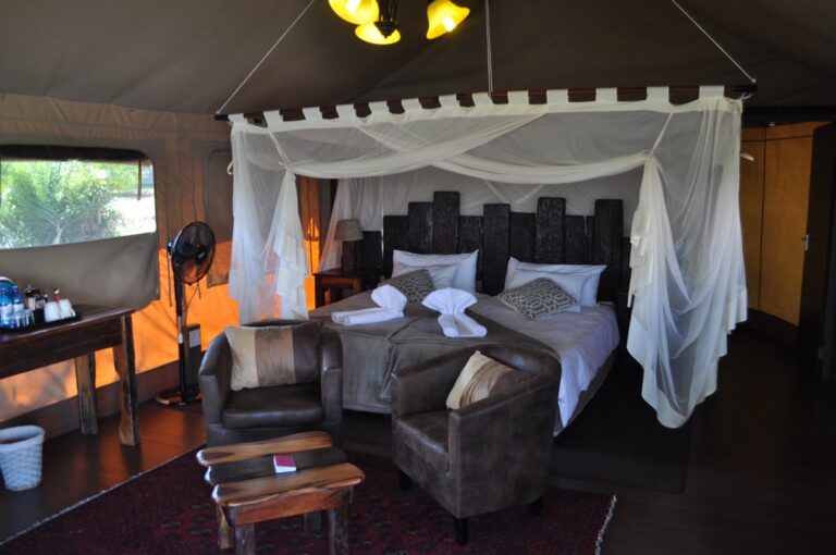 Kavango River lodge – four-poster bed inside a luxury tent