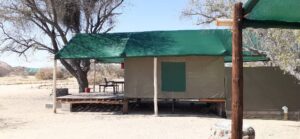 Spitzkoppe accommodation – family tent beneath a green shade roof