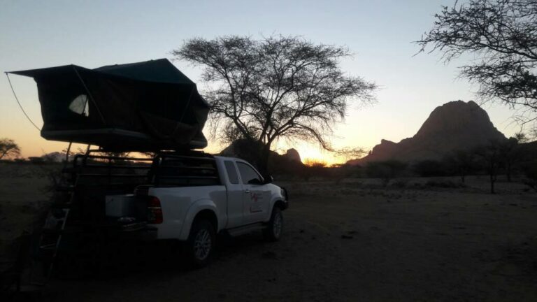 Spitzkoppe campsites – rooftop camper silhouetted against Spitzkoppe