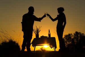Auob River accommodation – sundowner table in silhouette