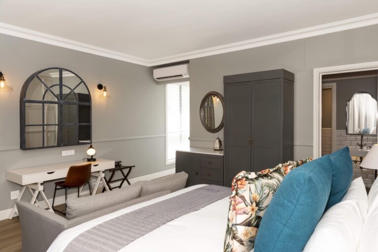 The Weinberg Hotel – grey guest room with desk