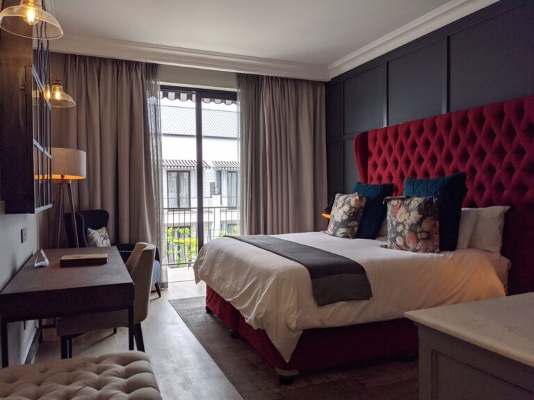 Klein Windhoek accommodation – guest room with red headboard