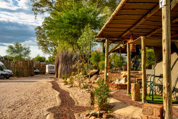 central Windhoek campsite – shaded veranda beside tented rooms
