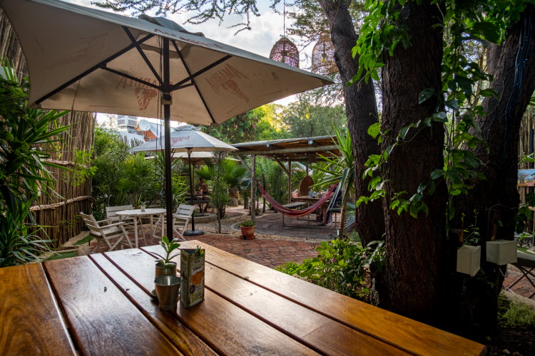 Windhoek glamping – shaded beer garden tables