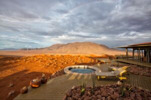 NamibRand accommodation – desert lodge pool and mountain view