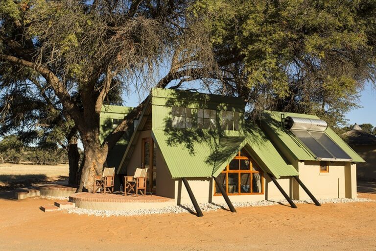 Kalahari camping – private chalet beneath camel-thorn trees