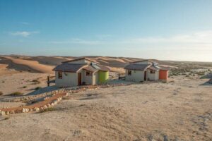 Desert Breeze accommodation – bungalows beside dunes