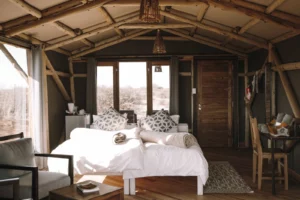 Tented room with a Kalahari dune view at Teufelskrallen Lodge