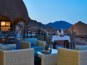 Desert Hills Lodge – outdoor lounge at dusk