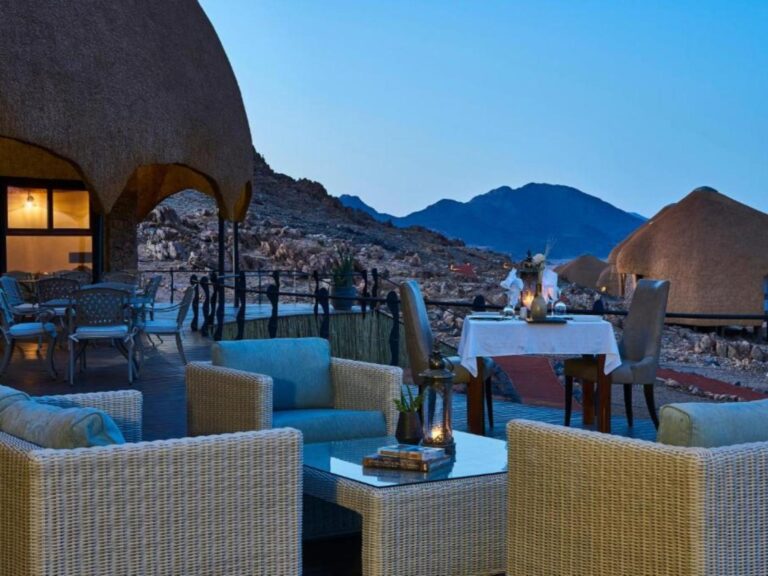 Desert Hills Lodge – outdoor lounge at dusk
