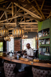 Etosha Oberland Lodge – bartender at the bar