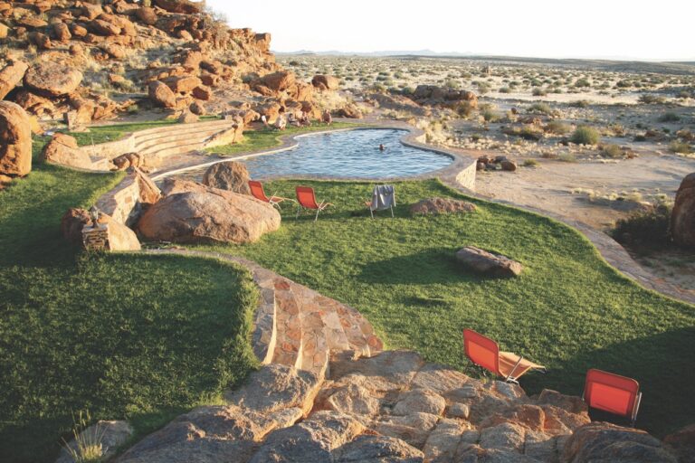 Canyon Lodge swimming pool and lawns in the rocky landscape