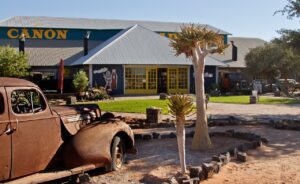 Canyon Roadhouse exterior with historic vehicle display