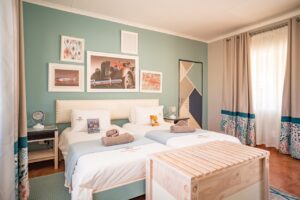 Bright guest room with double bed at Canyon Roadhouse