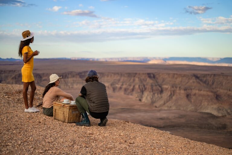 Guests seated above the canyon during a Canyon Village excursion