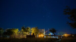 Chobe River Camp main lodge beneath a starry night sky