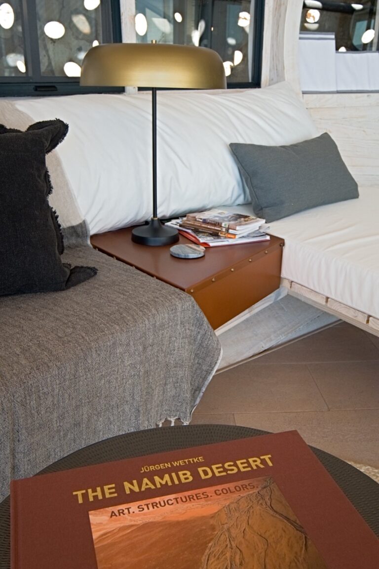 Welcome guide and bedroom detail at Desert Whisper