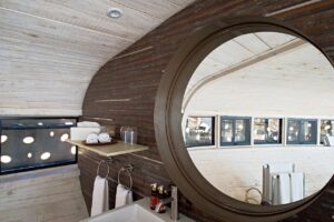 Round mirror and vanity in the Desert Whisper bathroom