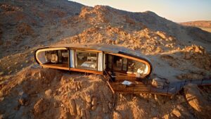 Aerial view of Desert Whisper among rocky hills