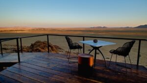 Outdoor dining deck facing the Namib Desert at Desert Whisper