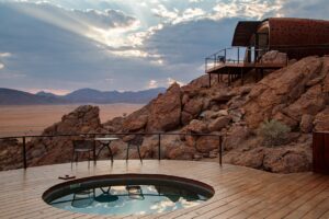 Desert Whisper plunge pool and rocky hillside terrace