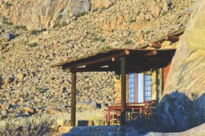 Private chalet veranda among granite rocks near Aus