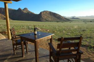 Private veranda dining with mountain views near Aus