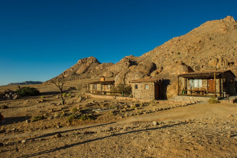 Group of stone Eagles Nest Chalets near Aus