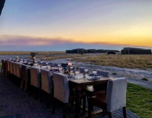 Sunset dinner table overlooking the plains at Etosha King Nehale