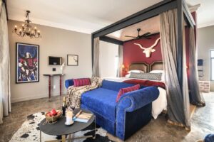 Etosha King Nehale bungalow bedroom with colourful lounge seating