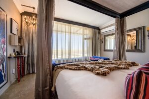 Double bed inside an Etosha King Nehale bungalow