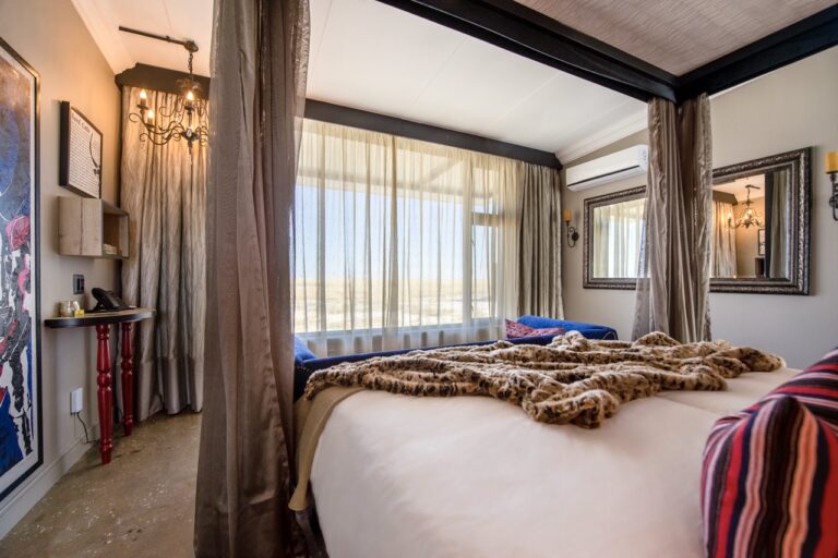Double bed inside an Etosha King Nehale bungalow