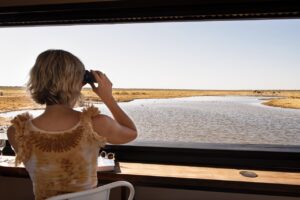 Guest photographing wildlife from the Etosha King Nehale hide