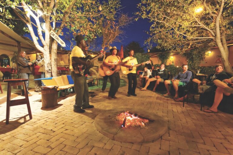 Evening musicians beside the fire at Etosha Safari Camp