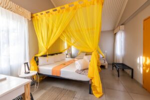 Bright standard bedroom at Etosha Safari Camp