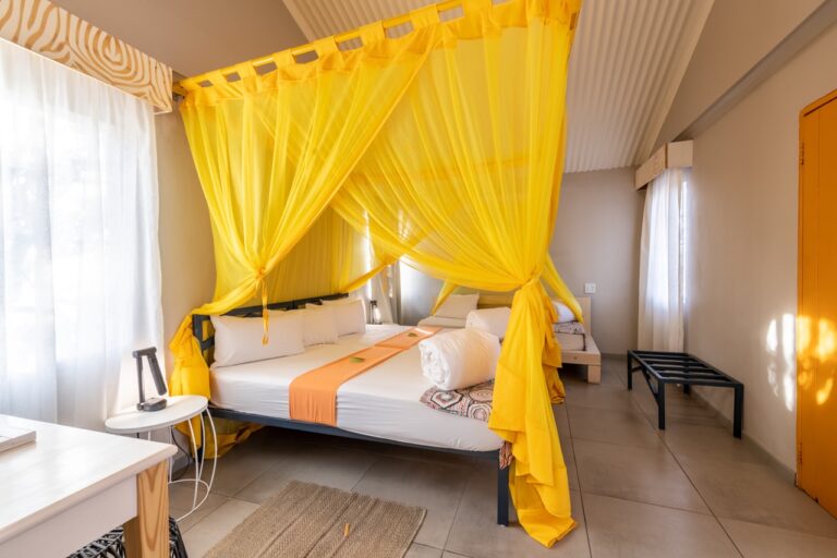 Bright standard bedroom at Etosha Safari Camp