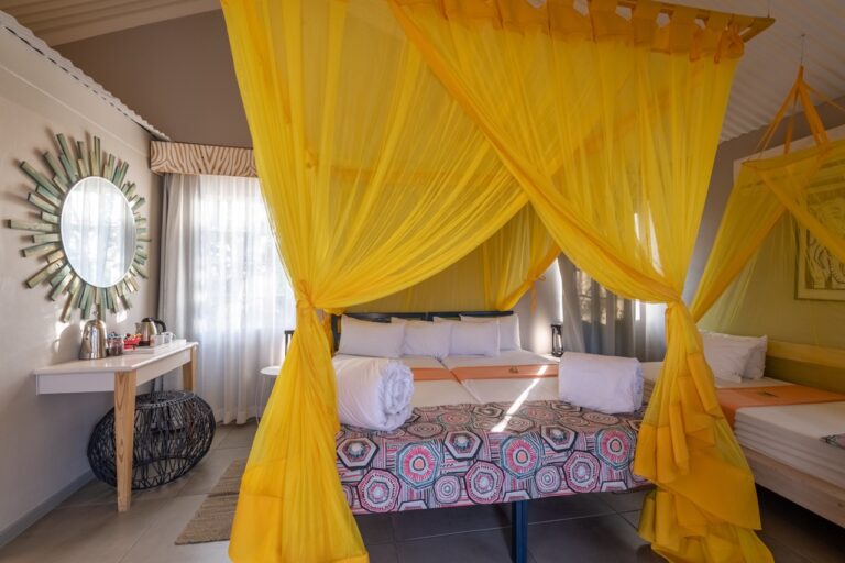 Double chalet room with yellow mosquito netting