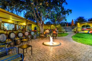 Colourful Oshebeena bar courtyard after dark