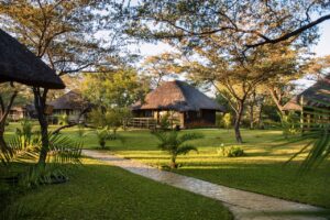 Hakusembe River Lodge chalets in the riverside gardens
