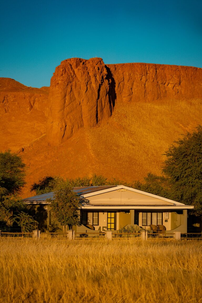 Namib Desert Lodge room exterior and dune backdrop