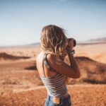 Traveller photographing desert scenery near Namib Desert Lodge