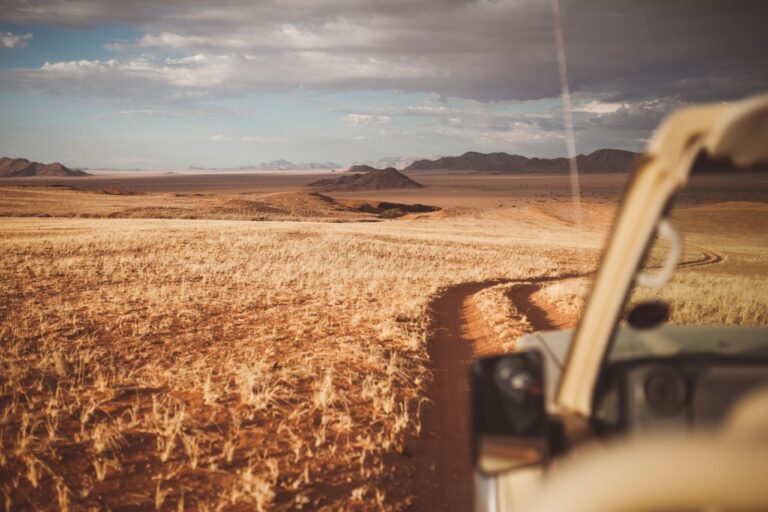Safari vehicle on a guided Namib Desert Lodge activity