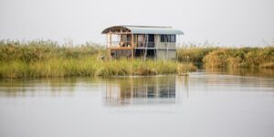 Private river villa viewed across a quiet Kwando channel